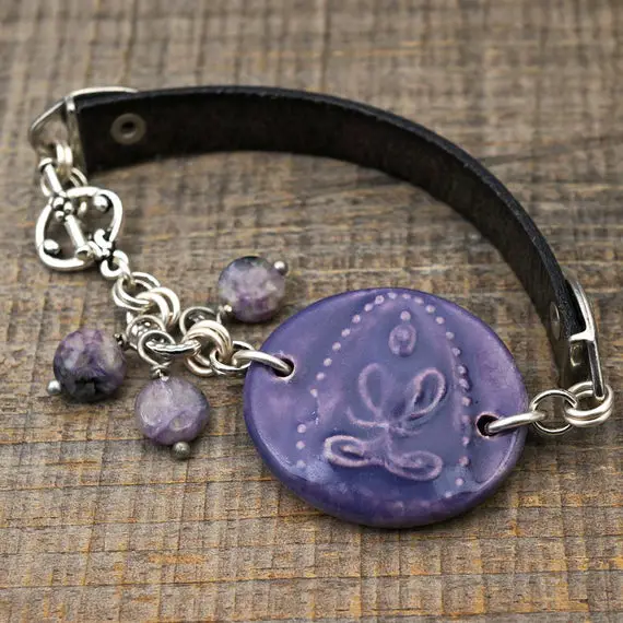 Light Purple Buddha Bracelet, Ceramic, Leather, And Silver, Lavender And Black Charoite Beads, 7 1/2 Inches Long