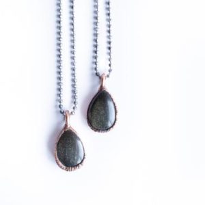 Shop Golden Obsidian Jewelry! Gold sheen obsidian necklace | Raw obsidian jewelry | Gold sheen obsidian | Obsidian necklace | Obsidian pendant | Black obsidian necklace | Natural genuine Golden Obsidian jewelry. Buy crystal jewelry, handmade handcrafted artisan jewelry for women.  Unique handmade gift ideas. #jewelry #beadedjewelry #beadedjewelry #gift #shopping #handmadejewelry #fashion #style #product #jewelry #affiliate #ad