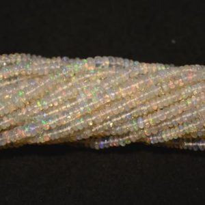 Shop Opal Rondelle Beads! 3mm Ethiopian Opal Beads, Natural Ethiopian Welo Opal Rondelle Beads, Opal Plain Rondelles, 16 Inch Strand, G220 | Natural genuine rondelle Opal beads for beading and jewelry making.  #jewelry #beads #beadedjewelry #diyjewelry #jewelrymaking #beadstore #beading #affiliate #ad