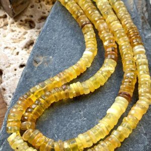 Shop Opal Beads! Amazing glowy Honey Yellow Opal Rondelle Spacer Heishi Beads / Golden Opal beads 6-7mm approx | Natural genuine beads Opal beads for beading and jewelry making.  #jewelry #beads #beadedjewelry #diyjewelry #jewelrymaking #beadstore #beading #affiliate #ad