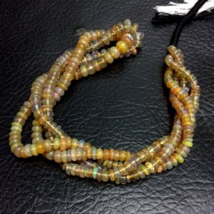 Shop Opal Rondelle Beads! Natural Smooth Ethiopian Opal Fire Beads Rondelle Shape 4-5mm Loose Gemstone Beads 16" Strand Top Quality New Arrival | Natural genuine rondelle Opal beads for beading and jewelry making.  #jewelry #beads #beadedjewelry #diyjewelry #jewelrymaking #beadstore #beading #affiliate #ad