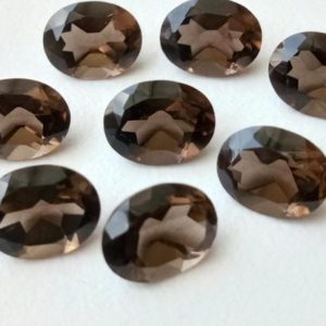 Shop Smoky Quartz Shapes! 10 Pcs Smoky Quartz Oval Cut Stones, Natural Smoky Quartz Oval Cut Loose Gemstone For Jewelry, Brown Stone (10x12mm To 15x20mm Options) | Natural genuine stones & crystals in various shapes & sizes. Buy raw cut, tumbled, or polished gemstones for making jewelry or crystal healing energy vibration raising reiki stones. #crystals #gemstones #crystalhealing #crystalsandgemstones #energyhealing #affiliate #ad