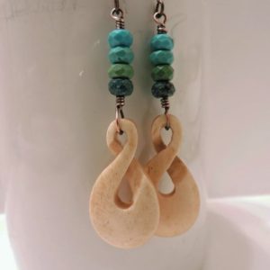 Shop Turquoise Stones & Crystals! Layered Blue, Green and Brown Chinese Turquoise with Carved Bone Twisted Loops | Natural genuine stones & crystals in various shapes & sizes. Buy raw cut, tumbled, or polished gemstones for making jewelry or crystal healing energy vibration raising reiki stones. #crystals #gemstones #crystalhealing #crystalsandgemstones #energyhealing #affiliate #ad