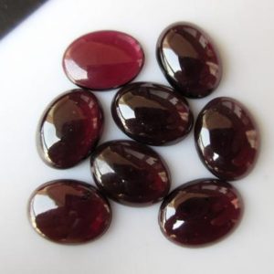 Shop Garnet Cabochons! 5 Pieces Smooth Oval Shaped Wine Red Garnet Loose Gemstone Cabochons GDS1047/2 | Natural genuine stones & crystals in various shapes & sizes. Buy raw cut, tumbled, or polished gemstones for making jewelry or crystal healing energy vibration raising reiki stones. #crystals #gemstones #crystalhealing #crystalsandgemstones #energyhealing #affiliate #ad