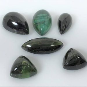 Shop Green Tourmaline Stones & Crystals! Green Tourmaline Cabochon Suite, 18.11 carat total weight | Natural genuine stones & crystals in various shapes & sizes. Buy raw cut, tumbled, or polished gemstones for making jewelry or crystal healing energy vibration raising reiki stones. #crystals #gemstones #crystalhealing #crystalsandgemstones #energyhealing #affiliate #ad