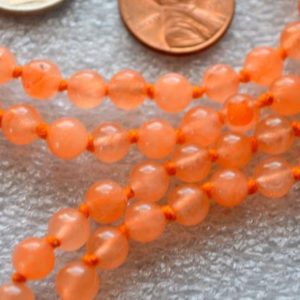 Shop Jade Necklaces! Orange Jade Hand Knotted Tassel Mala Beads Necklace -Energized Karma, Nirvana Meditation 6mm 108 Prayer Beads For Awakening Chakra Kundalini | Natural genuine Jade necklaces. Buy crystal jewelry, handmade handcrafted artisan jewelry for women.  Unique handmade gift ideas. #jewelry #beadednecklaces #beadedjewelry #gift #shopping #handmadejewelry #fashion #style #product #necklaces #affiliate #ad