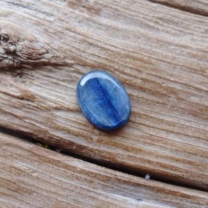 Shop Kyanite Stones & Crystals! Kyanite cabochon 16x12mm, Natural Blue Kyanite Cabochons | Natural genuine stones & crystals in various shapes & sizes. Buy raw cut, tumbled, or polished gemstones for making jewelry or crystal healing energy vibration raising reiki stones. #crystals #gemstones #crystalhealing #crystalsandgemstones #energyhealing #affiliate #ad