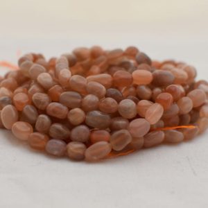 Shop Moonstone Chip & Nugget Beads! High Quality Grade A Natural Peach Moonstone Semi-Precious Gemstone Tumbled Stone Nugget Pebble Beads – approx 5mm – 8mm – 15.5" strand | Natural genuine chip Moonstone beads for beading and jewelry making.  #jewelry #beads #beadedjewelry #diyjewelry #jewelrymaking #beadstore #beading #affiliate #ad