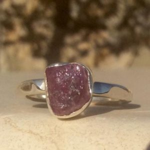 Shop Pink Sapphire Rings! Raw Pink Sapphire Silver Ring, Rough Gemstone Jewellery, Bridesmaid Gifts | Natural genuine Pink Sapphire rings, simple unique handcrafted gemstone rings. #rings #jewelry #shopping #gift #handmade #fashion #style #affiliate #ad