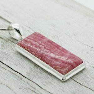 Shop Rhodochrosite Pendants! Big long Rhodochrosite pendant rectangle shape pink rhodochrosite stone necklace set on sterling silver 925 genuine rhodochrosite stone | Natural genuine Rhodochrosite pendants. Buy crystal jewelry, handmade handcrafted artisan jewelry for women.  Unique handmade gift ideas. #jewelry #beadedpendants #beadedjewelry #gift #shopping #handmadejewelry #fashion #style #product #pendants #affiliate #ad