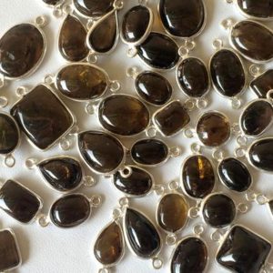 Shop Smoky Quartz Shapes! 6-12mm Smoky Quartz Connectors, Smoky Quartz Mix Shapes 925 Silver Connectors, 5 PcsSmoky Quartz Bezel Connectors, Finding Charm – GODPC5006 | Natural genuine stones & crystals in various shapes & sizes. Buy raw cut, tumbled, or polished gemstones for making jewelry or crystal healing energy vibration raising reiki stones. #crystals #gemstones #crystalhealing #crystalsandgemstones #energyhealing #affiliate #ad