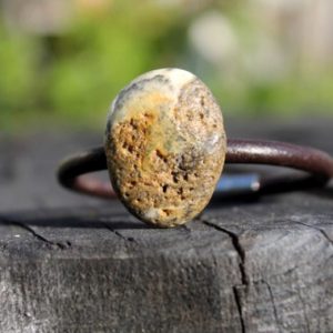 Shop Amber Jewelry! Raw Amber Leather Rustic Pebble Bracelet Oval Gray Black Dark Raw Stone Jewelry Pure Eco Natural Fashion Summer Primitive Rough OOAK | Natural genuine Amber jewelry. Buy crystal jewelry, handmade handcrafted artisan jewelry for women.  Unique handmade gift ideas. #jewelry #beadedjewelry #beadedjewelry #gift #shopping #handmadejewelry #fashion #style #product #jewelry #affiliate #ad