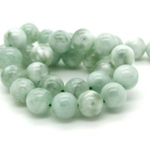 Shop Angelite Beads! Green Angelite Beads, Natural Green Angelite Smooth Round Ball Sphere Gemstone Beads – Full Strand | Natural genuine round Angelite beads for beading and jewelry making.  #jewelry #beads #beadedjewelry #diyjewelry #jewelrymaking #beadstore #beading #affiliate #ad