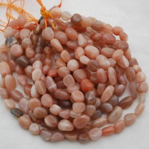 Shop Moonstone Chip & Nugget Beads! High Quality Grade A Natural Peach Moonstone Semi-precious Gemstone Pebble Tumbled stone Nugget Beads 7mm-10mm – 15" strand | Natural genuine chip Moonstone beads for beading and jewelry making.  #jewelry #beads #beadedjewelry #diyjewelry #jewelrymaking #beadstore #beading #affiliate #ad