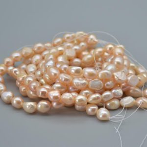 Shop Pearl Chip & Nugget Beads! Natural Freshwater Baroque Nugget Pearl Beads – Pink, Peach, Orange – 9mm – 10mm – 14" strand | Natural genuine chip Pearl beads for beading and jewelry making.  #jewelry #beads #beadedjewelry #diyjewelry #jewelrymaking #beadstore #beading #affiliate #ad