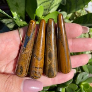 Shop Tiger Eye Points & Wands! Tiger eye wand, tiger eye point, courage, strength, luck | Natural genuine stones & crystals in various shapes & sizes. Buy raw cut, tumbled, or polished gemstones for making jewelry or crystal healing energy vibration raising reiki stones. #crystals #gemstones #crystalhealing #crystalsandgemstones #energyhealing #affiliate #ad