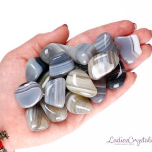 Shop Tumbled Agate Crystals & Pocket Stones! One Grey Banded Agate Tumbled Stone, Grey Agate Tumbled Stones, Zodiac Stones, Grey Banded Agate Palm Smooth Stones, Zodiac Stones | Natural genuine stones & crystals in various shapes & sizes. Buy raw cut, tumbled, or polished gemstones for making jewelry or crystal healing energy vibration raising reiki stones. #crystals #gemstones #crystalhealing #crystalsandgemstones #energyhealing #affiliate #ad