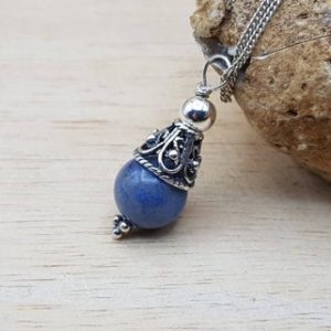 Shop Dumortierite Pendants! Small Dumortierite pendant necklace. Reiki jewelry uk. 10mm blue stone. Bali silver filigree cone necklace | Natural genuine Dumortierite pendants. Buy crystal jewelry, handmade handcrafted artisan jewelry for women.  Unique handmade gift ideas. #jewelry #beadedpendants #beadedjewelry #gift #shopping #handmadejewelry #fashion #style #product #pendants #affiliate #ad