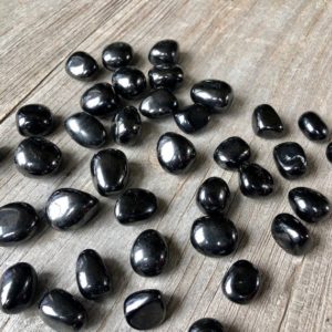 Shop Jet Stones & Crystals! Jet pebbles D200E | Natural genuine stones & crystals in various shapes & sizes. Buy raw cut, tumbled, or polished gemstones for making jewelry or crystal healing energy vibration raising reiki stones. #crystals #gemstones #crystalhealing #crystalsandgemstones #energyhealing #affiliate #ad