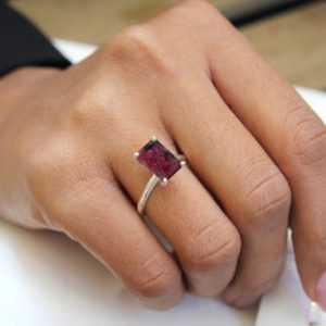 Shop Rhodonite Rings! Pink Rhodonite Gemstone Ring · Rectangle Gold Engagement Ring · Custom Emerald Cut Pink Ring · Gift For Her Wedding Ring | Natural genuine Rhodonite rings, simple unique alternative gemstone engagement rings. #rings #jewelry #bridal #wedding #jewelryaccessories #engagementrings #weddingideas #affiliate #ad
