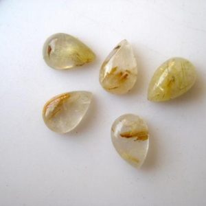 Shop Rutilated Quartz Cabochons! 20 Pieces 9x6mm Each Gold Rutilated Quartz Pear Shaped Smooth Flat Back Loose Cabochons BB244 | Natural genuine stones & crystals in various shapes & sizes. Buy raw cut, tumbled, or polished gemstones for making jewelry or crystal healing energy vibration raising reiki stones. #crystals #gemstones #crystalhealing #crystalsandgemstones #energyhealing #affiliate #ad