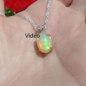 Shop Opal Necklaces! Orange Ethiopian Fire Opal Necklace, Sterling Silver, Large Florescent Play 3 Carat Extreme Fire  12.50 x 8.80 mm Natural AAA+++ Fire Opal | Natural genuine Opal necklaces. Buy crystal jewelry, handmade handcrafted artisan jewelry for women.  Unique handmade gift ideas. #jewelry #beadednecklaces #beadedjewelry #gift #shopping #handmadejewelry #fashion #style #product #necklaces #affiliate #ad