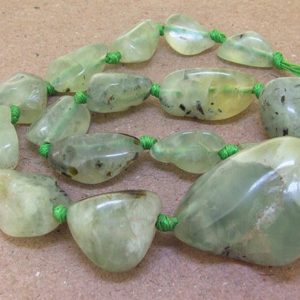 Shop Prehnite Chip & Nugget Beads! Knotted One Full Strand—–  Natural Nugget prehnite Beads —– 12mmx38mm —– about 15 Pieces —– gemstone beads— 17" in length | Natural genuine chip Prehnite beads for beading and jewelry making.  #jewelry #beads #beadedjewelry #diyjewelry #jewelrymaking #beadstore #beading #affiliate #ad