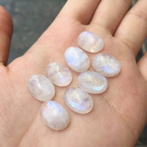 Shop Rainbow Moonstone Stones & Crystals! Rainbow Moonstone Cabochon Oval Shaped 14x10mm | Natural genuine stones & crystals in various shapes & sizes. Buy raw cut, tumbled, or polished gemstones for making jewelry or crystal healing energy vibration raising reiki stones. #crystals #gemstones #crystalhealing #crystalsandgemstones #energyhealing #affiliate #ad