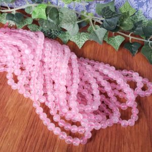 Shop Rose Quartz Round Beads! Rose Quartz Crystal Bead Strand, Small 6mm Smooth Round Gemstone Beads with 0.8mm Hole | Natural genuine round Rose Quartz beads for beading and jewelry making.  #jewelry #beads #beadedjewelry #diyjewelry #jewelrymaking #beadstore #beading #affiliate #ad