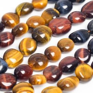 Shop Tiger Eye Chip & Nugget Beads! Genuine Natural Yellow Red Blue Tiger Eye Loose Beads Grade AA Pebble Nugget Shape 7-9mm | Natural genuine chip Tiger Eye beads for beading and jewelry making.  #jewelry #beads #beadedjewelry #diyjewelry #jewelrymaking #beadstore #beading #affiliate #ad