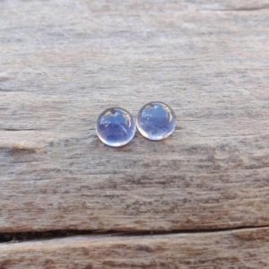 Shop Iolite Stones & Crystals! Pair small Iolite round cabochons 5x3mm | Natural genuine stones & crystals in various shapes & sizes. Buy raw cut, tumbled, or polished gemstones for making jewelry or crystal healing energy vibration raising reiki stones. #crystals #gemstones #crystalhealing #crystalsandgemstones #energyhealing #affiliate #ad