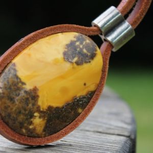 Shop Amber Pendants! Long Amber Necklace Lariat Leather Unique Design Rare Amber Stone Oval Amber Pendant Tan Leather | Natural genuine Amber pendants. Buy crystal jewelry, handmade handcrafted artisan jewelry for women.  Unique handmade gift ideas. #jewelry #beadedpendants #beadedjewelry #gift #shopping #handmadejewelry #fashion #style #product #pendants #affiliate #ad
