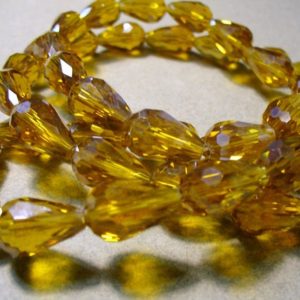 Shop Amber Bead Shapes! Crystal Beads Briolettes  or Teardrop 15x10MM | Natural genuine other-shape Amber beads for beading and jewelry making.  #jewelry #beads #beadedjewelry #diyjewelry #jewelrymaking #beadstore #beading #affiliate #ad