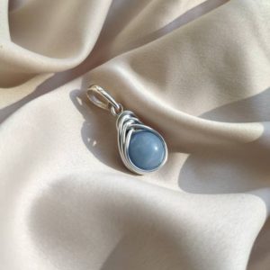 Shop Angelite Jewelry! Angelite wire wrapped pendant, Sterling silver bail pendant, Witchy women pendant, Boho blue stone indie necklace, Fairy elven charm gift | Natural genuine Angelite jewelry. Buy crystal jewelry, handmade handcrafted artisan jewelry for women.  Unique handmade gift ideas. #jewelry #beadedjewelry #beadedjewelry #gift #shopping #handmadejewelry #fashion #style #product #jewelry #affiliate #ad