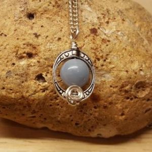 Blue Angelite pendant. Reiki jewelry uk. Small Oval frame pendant. | Natural genuine Angelite pendants. Buy crystal jewelry, handmade handcrafted artisan jewelry for women.  Unique handmade gift ideas. #jewelry #beadedpendants #beadedjewelry #gift #shopping #handmadejewelry #fashion #style #product #pendants #affiliate #ad