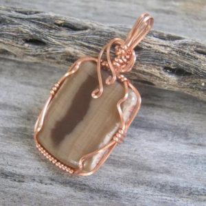 Shop Petrified Wood Pendants! Petrified Wood Pendant, Wire Wrapped in Copper, Heart & Root Chakra Pendant, Natural Brown and Tan Fossil, READY To SHIP | Natural genuine Petrified Wood pendants. Buy crystal jewelry, handmade handcrafted artisan jewelry for women.  Unique handmade gift ideas. #jewelry #beadedpendants #beadedjewelry #gift #shopping #handmadejewelry #fashion #style #product #pendants #affiliate #ad