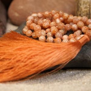 Shop Sunstone Necklaces! Sunstone AAA Knotted Mala (AAA) (108 and Guru), Necklace 8-mm Beads with a Millennial Pink Tassel 1089 | Natural genuine Sunstone necklaces. Buy crystal jewelry, handmade handcrafted artisan jewelry for women.  Unique handmade gift ideas. #jewelry #beadednecklaces #beadedjewelry #gift #shopping #handmadejewelry #fashion #style #product #necklaces #affiliate #ad
