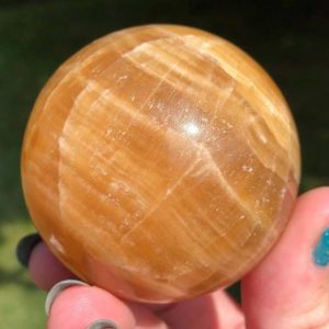 Shop Calcite Shapes! 2.2" Honey Calcite Sphere    Golden Glowing Yellow Honey Calcite Crystal Ball Gemstone Gift #9 | Natural genuine stones & crystals in various shapes & sizes. Buy raw cut, tumbled, or polished gemstones for making jewelry or crystal healing energy vibration raising reiki stones. #crystals #gemstones #crystalhealing #crystalsandgemstones #energyhealing #affiliate #ad