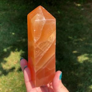 Shop Orange Calcite Points & Wands! 5.1" Honey Calcite Crystal Tower #10 Orange Calcite Point Polished Self Standing Glowing Gemstone Gift for Her, Witchy Home Decor Accent | Natural genuine stones & crystals in various shapes & sizes. Buy raw cut, tumbled, or polished gemstones for making jewelry or crystal healing energy vibration raising reiki stones. #crystals #gemstones #crystalhealing #crystalsandgemstones #energyhealing #affiliate #ad