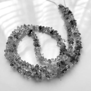 Shop Rutilated Quartz Chip & Nugget Beads! 1/2 strand Herkimer diamond quartz chips | Natural genuine chip Rutilated Quartz beads for beading and jewelry making.  #jewelry #beads #beadedjewelry #diyjewelry #jewelrymaking #beadstore #beading #affiliate #ad