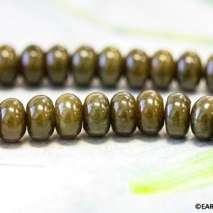 Shop Serpentine Rondelle Beads! M-S/ Soocho Jade 10mm/ 8mm/ 6mm Smooth Rondelle Beads Olive Green color jade  15.5" long.  Genuine serpentine  wheel beads. | Natural genuine rondelle Serpentine beads for beading and jewelry making.  #jewelry #beads #beadedjewelry #diyjewelry #jewelrymaking #beadstore #beading #affiliate #ad