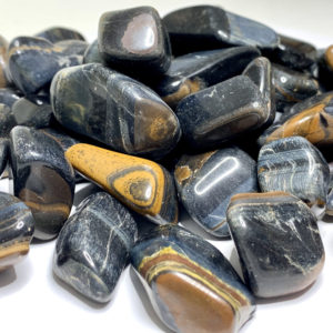 Shop Tumbled Tiger Eye Crystals & Pocket Stones! Blue Tigers Eye Tumbled Stones | Natural genuine stones & crystals in various shapes & sizes. Buy raw cut, tumbled, or polished gemstones for making jewelry or crystal healing energy vibration raising reiki stones. #crystals #gemstones #crystalhealing #crystalsandgemstones #energyhealing #affiliate #ad
