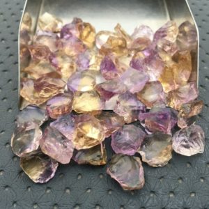 Shop Raw & Rough Ametrine Stones! 25 Pieces Ametrine Raw Size 10-12 MM,Ametrine Stones Bulk Lot, Untreated Ametrine Lapidary Rough, Ametrine Loose Rock stone ,Loose Gemstone | Natural genuine stones & crystals in various shapes & sizes. Buy raw cut, tumbled, or polished gemstones for making jewelry or crystal healing energy vibration raising reiki stones. #crystals #gemstones #crystalhealing #crystalsandgemstones #energyhealing #affiliate #ad