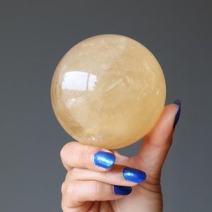 Shop Calcite Shapes! Honey Calcite Sphere, Sun-Kissed Crystal Ball | Natural genuine stones & crystals in various shapes & sizes. Buy raw cut, tumbled, or polished gemstones for making jewelry or crystal healing energy vibration raising reiki stones. #crystals #gemstones #crystalhealing #crystalsandgemstones #energyhealing #affiliate #ad