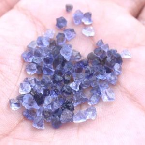 Shop Raw & Rough Iolite Stones! 50 Piece Tiny Natural Iolite Raw Rock Size 2-4 MM Raw Natural Untreated Blue Iolite Gemstone Raw Metaphysical Raw Crystal Genuine Iolite Raw | Natural genuine stones & crystals in various shapes & sizes. Buy raw cut, tumbled, or polished gemstones for making jewelry or crystal healing energy vibration raising reiki stones. #crystals #gemstones #crystalhealing #crystalsandgemstones #energyhealing #affiliate #ad