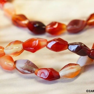 M/ Natural Carnelian 8x13mm/ 9x15mm/ 10x20mm Swirl beads 16" strand Twisted Oval beads Size/ Shade varies Well polished for jewelry making | Natural genuine other-shape Gemstone beads for beading and jewelry making.  #jewelry #beads #beadedjewelry #diyjewelry #jewelrymaking #beadstore #beading #affiliate #ad