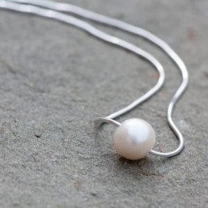 Shop Pearl Necklaces! Floating Pearl Necklace, 10mm Natural  Minimalist White Pearl Necklace, Sterling Silver Chain, Bridal Pearl Necklace, Anniversary | Natural genuine Pearl necklaces. Buy handcrafted artisan wedding jewelry.  Unique handmade bridal jewelry gift ideas. #jewelry #beadednecklaces #gift #crystaljewelry #shopping #handmadejewelry #wedding #bridal #necklaces #affiliate #ad