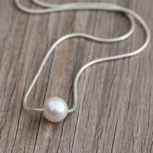 Shop Pearl Necklaces! Floating Pearl Necklace, 8mm Natural Minimalist White Pearl Necklace, 925 Sterling Silver Chain, Bridal Pearl Necklace, Anniversary | Natural genuine Pearl necklaces. Buy handcrafted artisan wedding jewelry.  Unique handmade bridal jewelry gift ideas. #jewelry #beadednecklaces #gift #crystaljewelry #shopping #handmadejewelry #wedding #bridal #necklaces #affiliate #ad