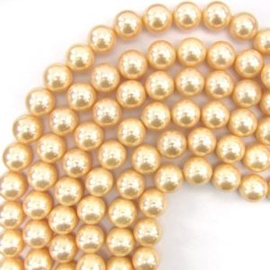 Shop Pearl Round Beads! 12mm pink shell pearl round beads 15" strand 13511 | Natural genuine round Pearl beads for beading and jewelry making.  #jewelry #beads #beadedjewelry #diyjewelry #jewelrymaking #beadstore #beading #affiliate #ad