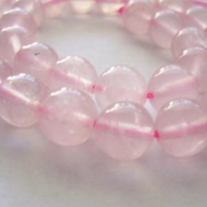Shop Rose Quartz Round Beads! Rose Quartz Beads Round 10mm | Natural genuine round Rose Quartz beads for beading and jewelry making.  #jewelry #beads #beadedjewelry #diyjewelry #jewelrymaking #beadstore #beading #affiliate #ad